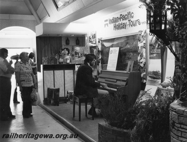 P00167
Royal Show display showing members of the public viewing a display advertising 