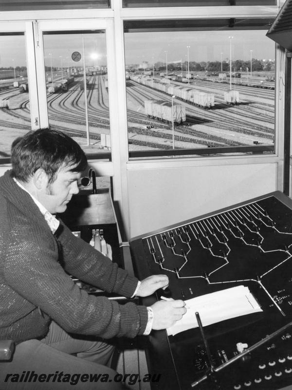 P00189
Hump yard operator sorting wagons, view of operator, consol and hump yard, similar view to P0188
