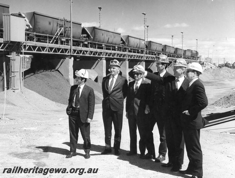 P00195
XC class bauxite wagons on the unloader at Alcoa, Kwinana, group of officials in the foreground, same as P0198
