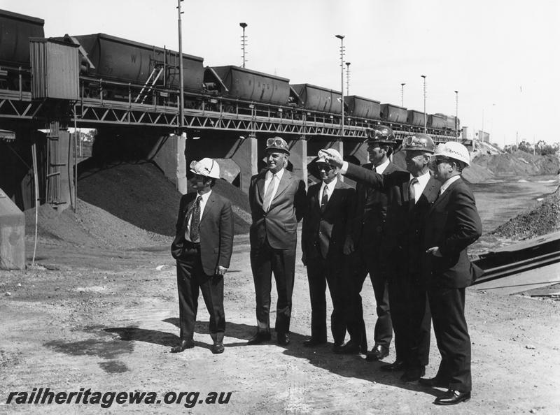 P00198
XC class bauxite wagons on the unloader at Alcoa, Kwinana, group of officials in the foreground, same as P0195
