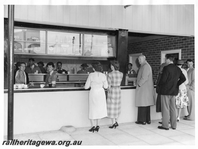 P00200
Patrons waiting at canteen counter.
