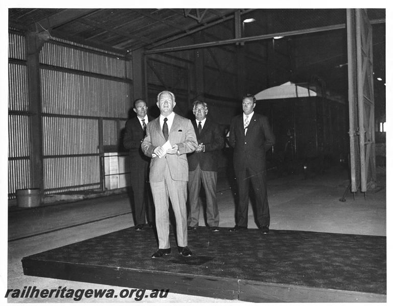 P00215
Mr R. J. Pascoe, Commissioner of Railways, Mr R. O'Connor, Minister for Railways, RCH class wheat wagon in background, ceremony at Avon Yard
