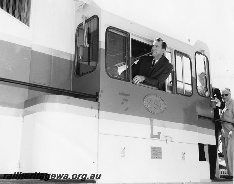 P00251
L class 251, view of cab, Minister for Railways Mr R. O'Connor leaning out of the cab window at the handing over ceremony of the loco. (ref: Railways Institute Magazine, Vol 64, December 1964, page 16)
