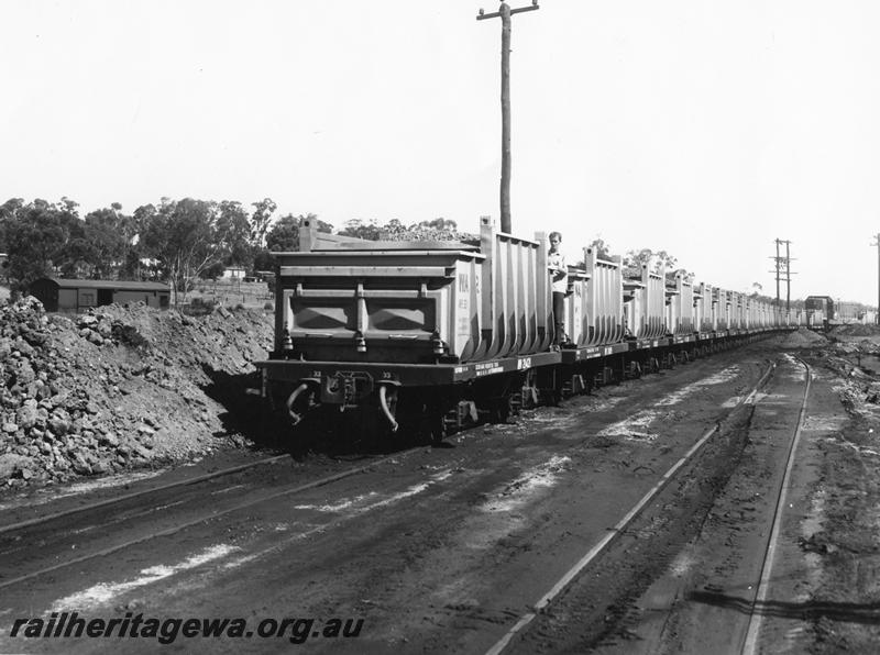 P00290
NW class four wheel iron ore container wagons, Wundowie, ER line, line of wagons being shunted 

