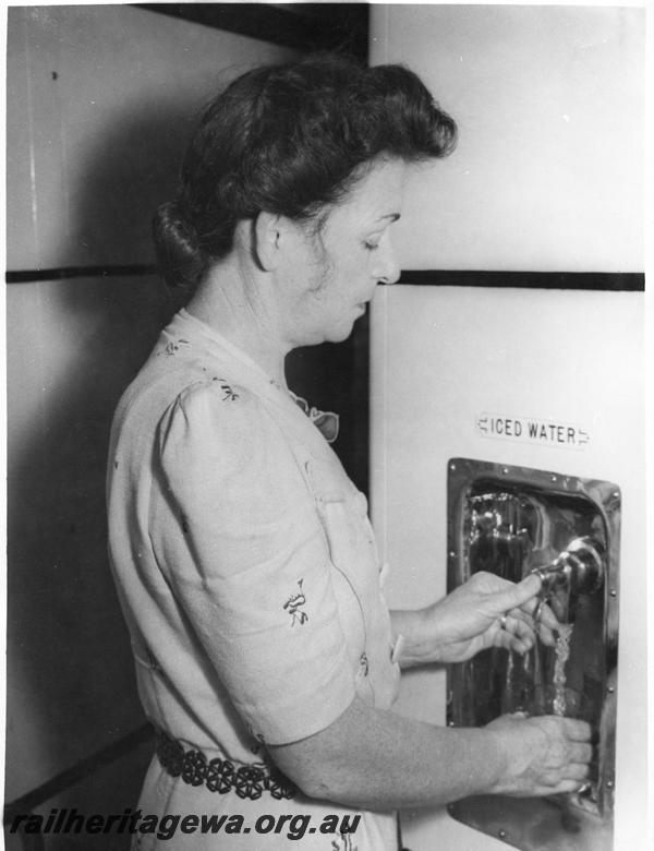 P00309
AH class carriage, view shows a passenger dispensing a drink of iced water.
