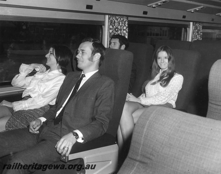 P00340
Prospector railcar, internal view showing seated passengers, publicity photo
