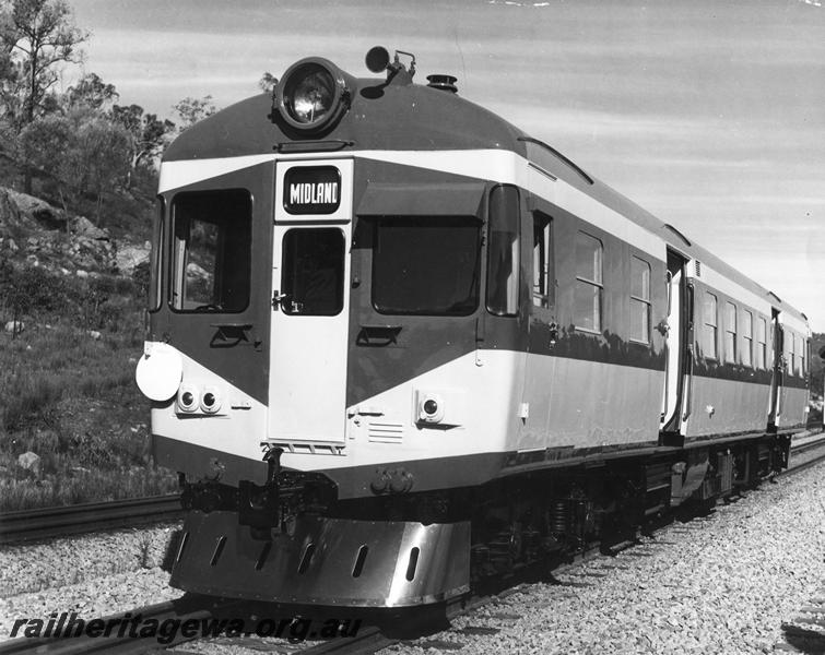 P00358
ADX class 670 in the Nanking blue and light grey livery with a stainless steel cowcatcher, missing gangways, trial run to Jumperkine,Avon Valley line, front and side view. (Ref: RIM August 1966)
