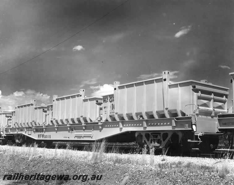 P00425
WFW class 30115 standard gauge bogie flat wagon, (later reclassified to WFDY), with iron ore containers on board, side and end view.
