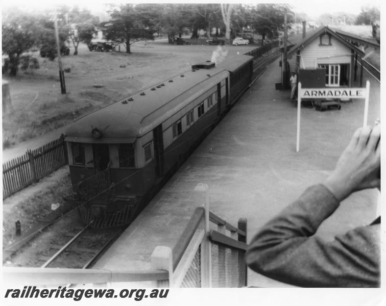 P00485
ASA class 445, steam railcar attached to a AD class carriage, Station buildings, nameboard, Armadale, SWR line, elevated view from the footbridge. 
