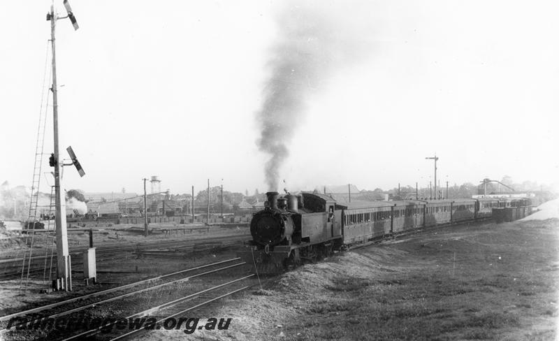 P00488
DS class, suburban carriages, very tall signal with two arms, leaving East Perth with suburban passenger train for Midland
