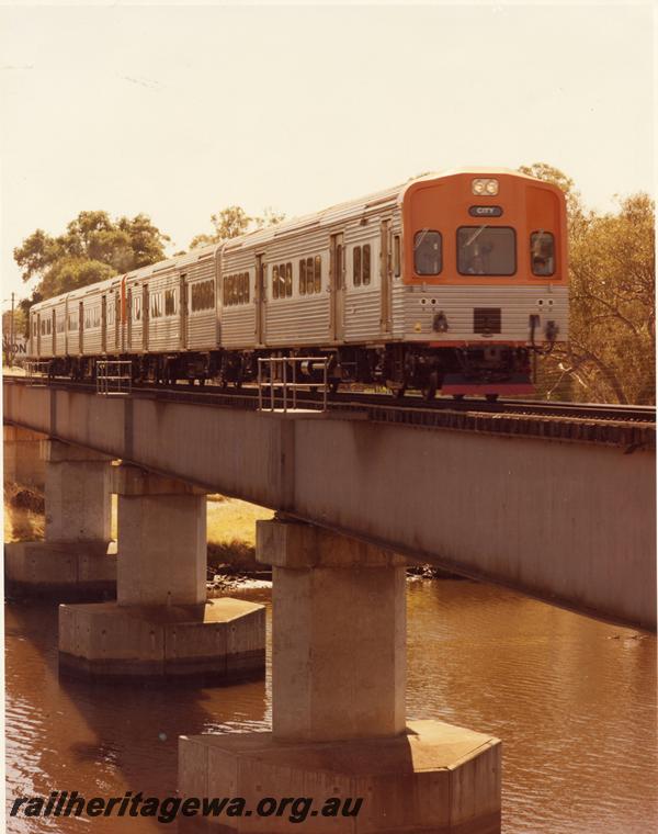 P00499
ADL class railcar set, steel girder bridge, Guildford, side and front view.
