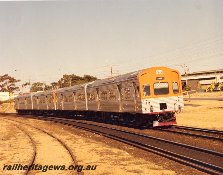 P00501
ADL/ADC class four car railcar set, between Ashfield and Bayswater, siding to Brady's Plaster works in the foreground
