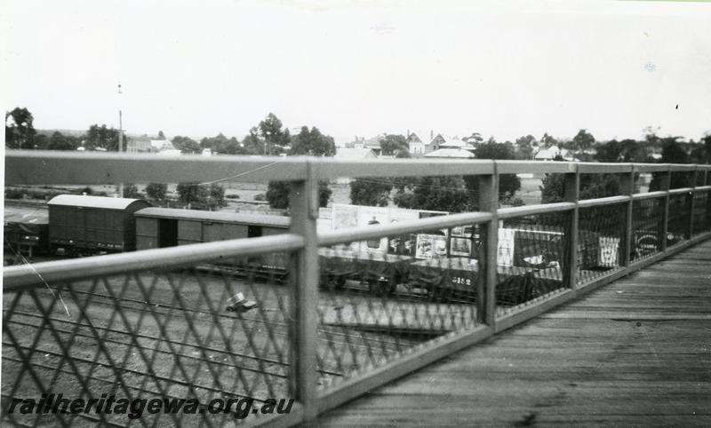 P00550
Footbridge, yard with goods wagons, Narrogin, GSR line, view from the footbridge.
