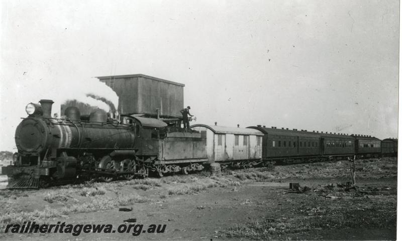 P00551
L class, water tower with a 25,000 gallon cast iron tank, Paroo. NR line, taking water, on 