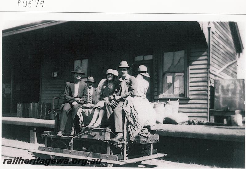P00579
Station, Three Springs, MR line, gangers trolley, musicians on board the trolley about to depart for Coorow using the trolley because of floods 
