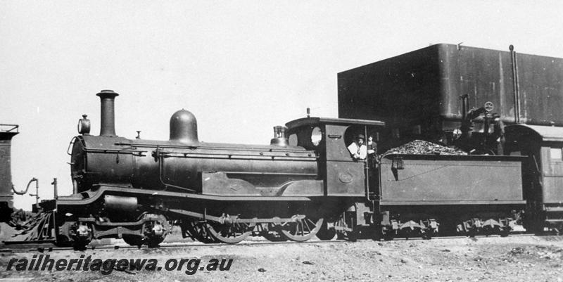 P00765
R class 174, water tower with a 25,000 gallon cast iron tank, Boondi, taking water, on the 