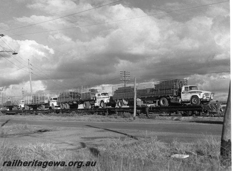 P00799
QU class wagons loaded with semi trailer road vehicles
