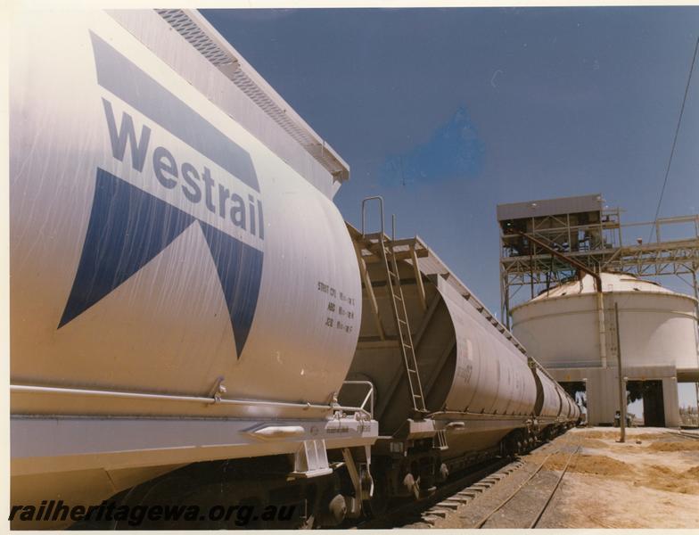 P00845
XF class alumina hoppers, loading bins, string of wagons being loaded.
