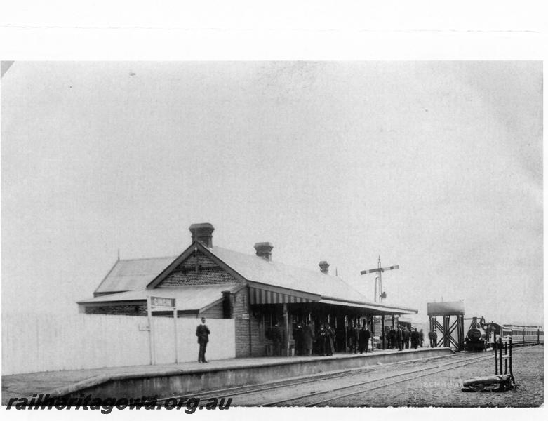 P00877
Station building, Gingin, MR line, trackside view looking east, shows MR style signal and water tower in background
