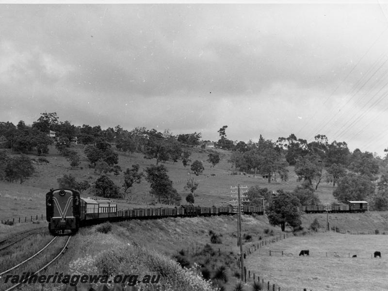 P00900
C class 1703, Swan View, ER line, goods train with three country carriages behind the loco
