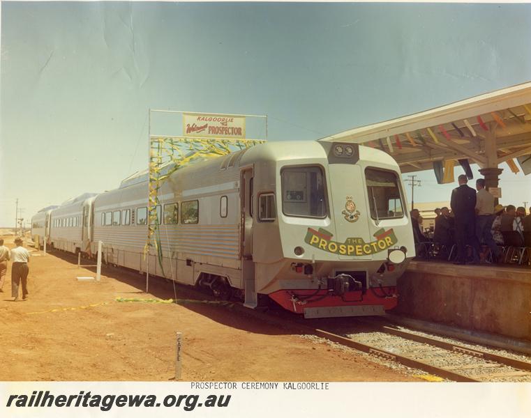 P00908
Prospector railcar set, breaking through banner at Kalgoorlie station, Inauguration of the Prospector service. Same as P7463
