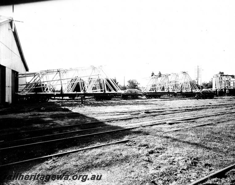 P00921
Prefabricated aircraft hanger on flat wagons, Geraldton, (Ref: 