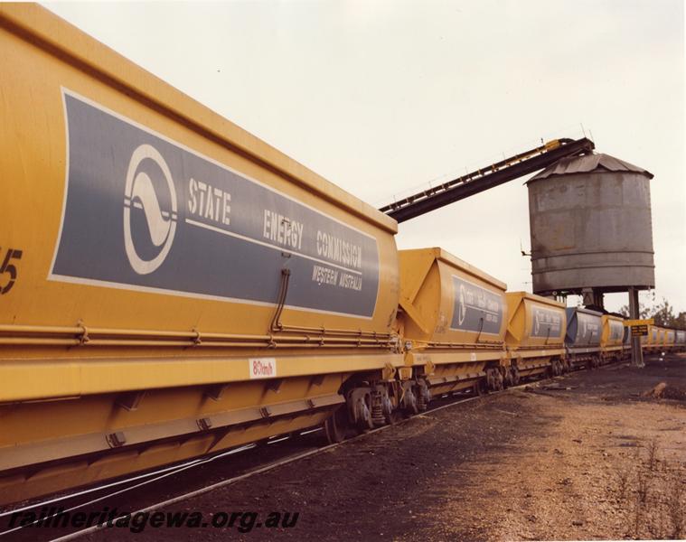 P00936
XG class coal hoppers in yellow livery with 