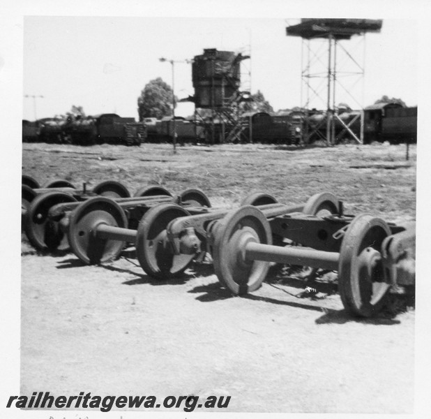 P01001
Bogies, standard gauge, in a row not on track, Midland loco depot in background
