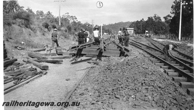 P01052
Track, installing the double slip in the Parkerville yard, ER line, view of workers lifting the double slip
