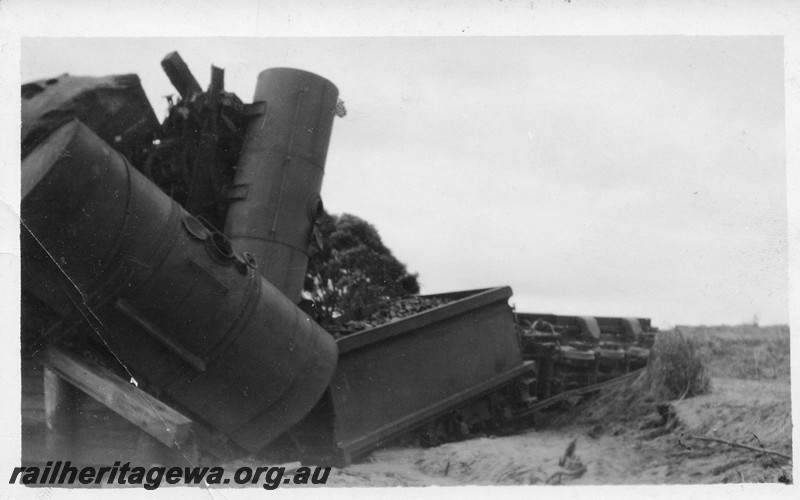 P01056
3 of 4 views of the derailment of No105 Mixed near Dumberning, BN line on the 14th of March, 1934, FS class loco on its side
