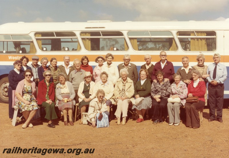 P01082
Tour patrons posing for a group photo in front of a Railway Road Service bus.
