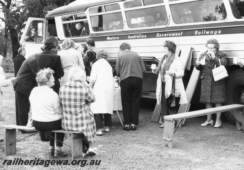 P01085
WAGR tour patrons taking refreshments in front of a Railway Road Service bus
