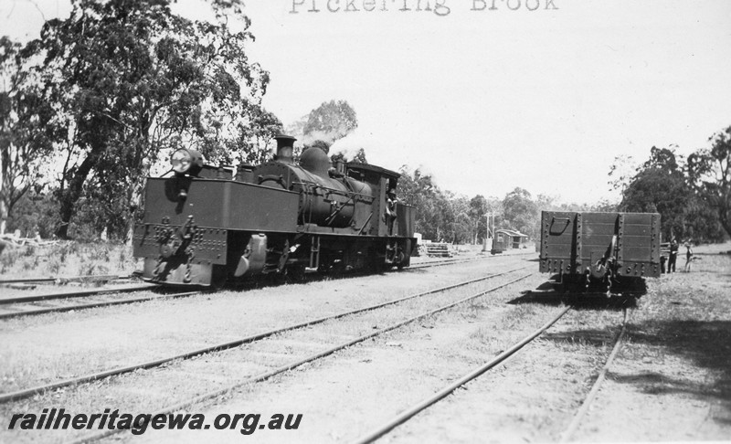P01087
MS class 428 Garratt loco, Pickering Brook, UDRR line, front and side view, station buildings in the background.
