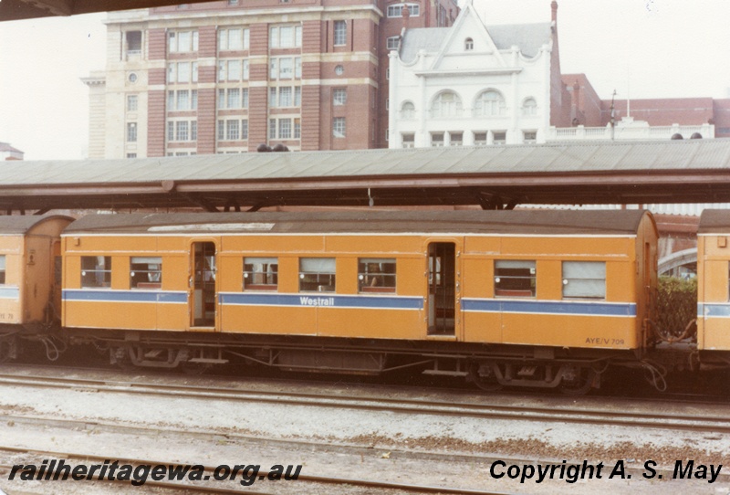 P01130
AYE/V class 709 carriage, orange livery, Westrail logo, side view, Perth, ER line.
