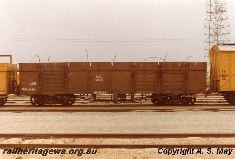 P01176
RBW class 11299, Leighton, brown livery, side view, end of DC class 21976 in the view.
