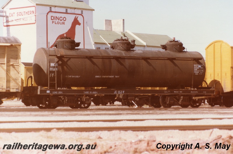 P01311
JC class 153 Vacuum Oil tanker, end and side view, Dingo Flour mill in the background, Leighton, ER line.
