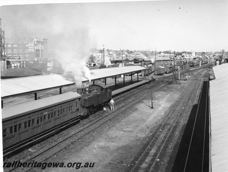 P01404
DM class on suburban passenger train to Fremantle, Perth Station, elevated view looking west.
