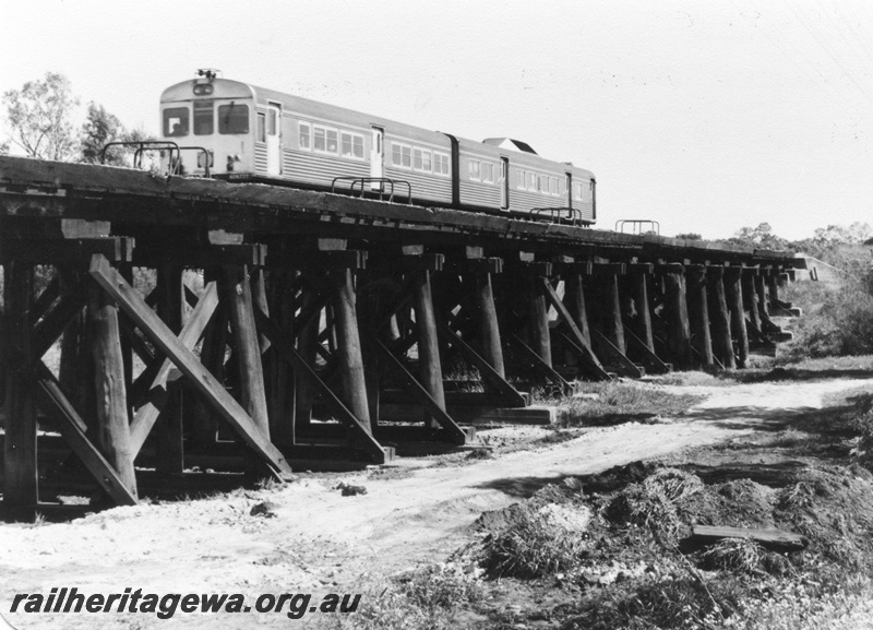P01419
14 of 16 images of the pair of trestle bridges over the Canning River at Gosnells, SWR line, ADB class, ADK class railcar set on the bridge, view taken from the south east.

