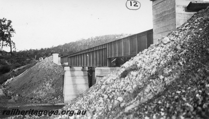 P01438
13 of 13 images of the construction of the duplicate steel girder bridge No.1 at 16 miles 25 chains on the ER through the John Forrest National Park, view of the bridge completed.
