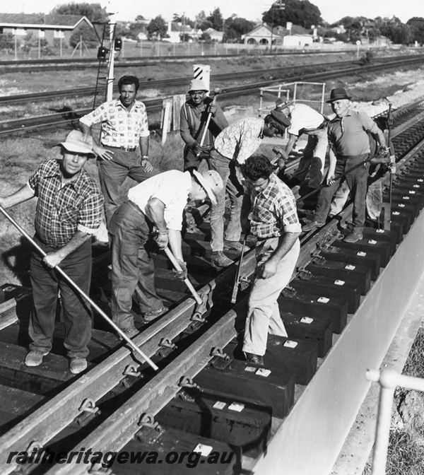 P01496
Bridge construction on the new bridge at Guildford, workers adjusting the rails.
