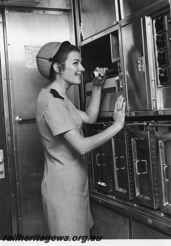 P01558
Prospector railcar, hostess making a PA announcement
