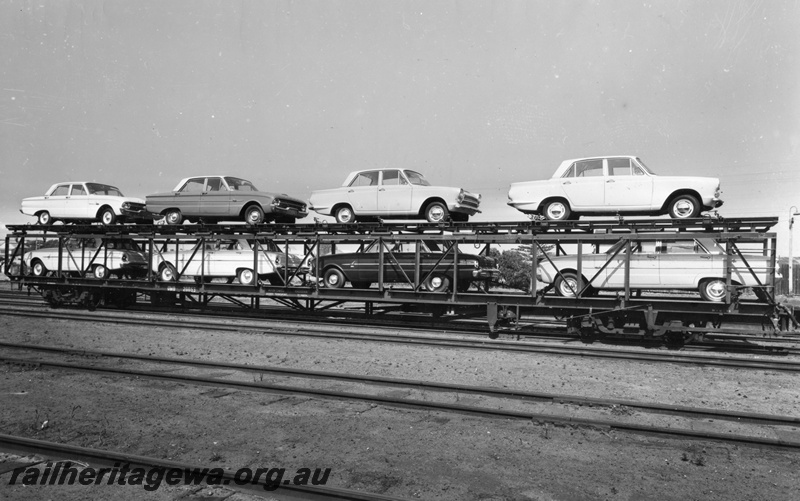 P01581
QMD class 20053 car carrying wagon with a variety of Ford cars on board, side view.
