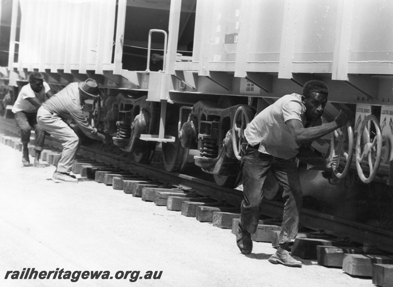 P01598
Ballasting on the standard gauge, Thursday Islanders working the ballast wagons.
