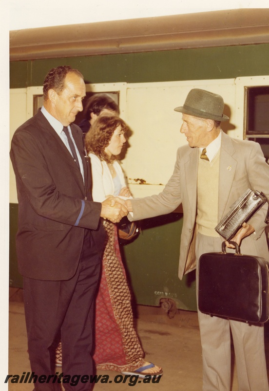 P01765
Passenger on the last Albany Progress hand being shaken by his father, a WAGR employee
