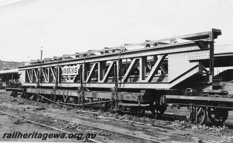 P01772
1 of 3 views of QA class 9393 bogie flat wagon carrying an over length electric crane traverser for the Great Boulder Mine, loaded at Perth Goods Yard, side and end view
