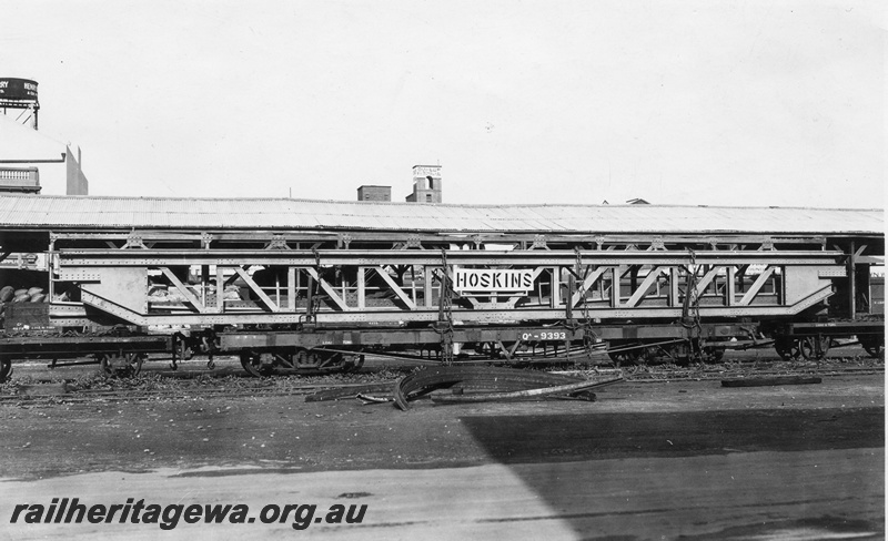 P01773
2 of 3 views of QA class 9393 bogie flat wagon carrying an over length electric crane traverser for the Great Boulder Mine, loaded at Perth Goods Yard, side view.
