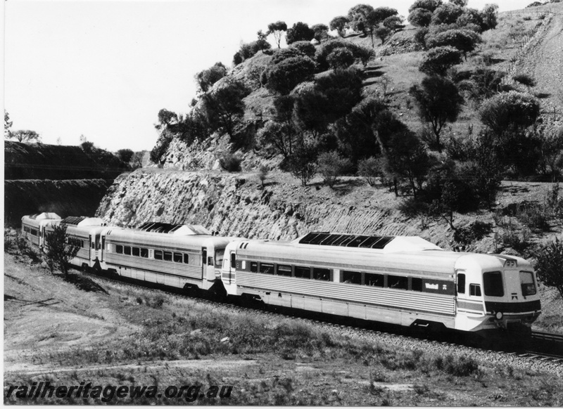 P01838
Four car Prospector railcar set entering the Avon Valley en route to Kalgoorlie, black and white version of T0359
