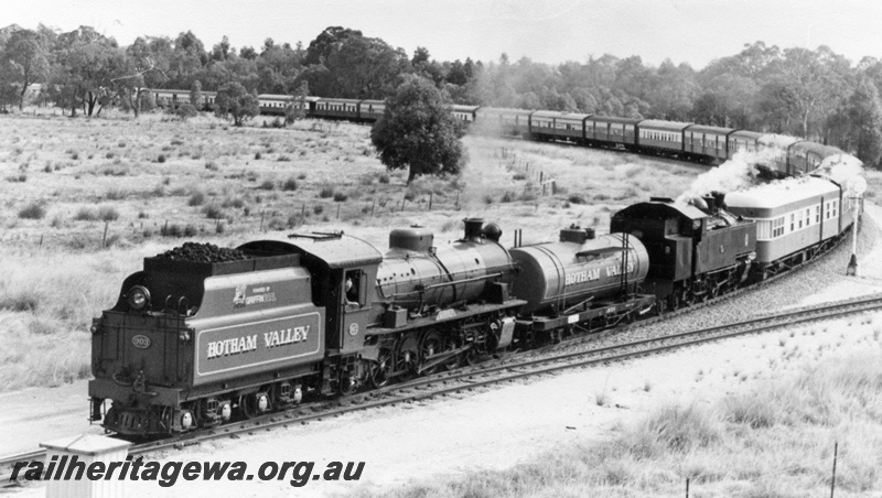 P01949
W class 903 and DD class 592 steam locomotives double heading, tender first, end and side view, at Wagerup, SWR line.
