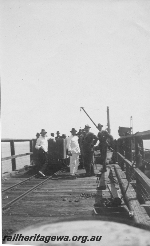P01983
Jetty, Onslow, men standing around a wagon, view along the jetty.
