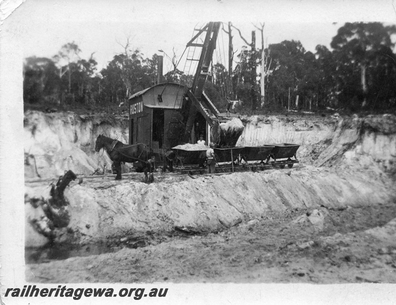 P02011
9 of 14. Ruston steam shovel loading horse drawn rake of skips, front and side view, construction of Denmark-Nornalup railway, D line.
